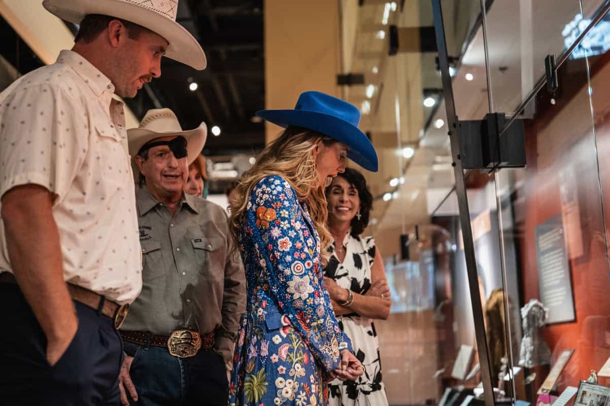 Lainey Wilson and Devlin "Duck" Hodges and family at Lainey Wilson: Tough as Nails exhibit inside the Country Music Hall of Fame and Museum; Photo by John Shearer/Getty Images for the Country Music Hall of Fame and Museum