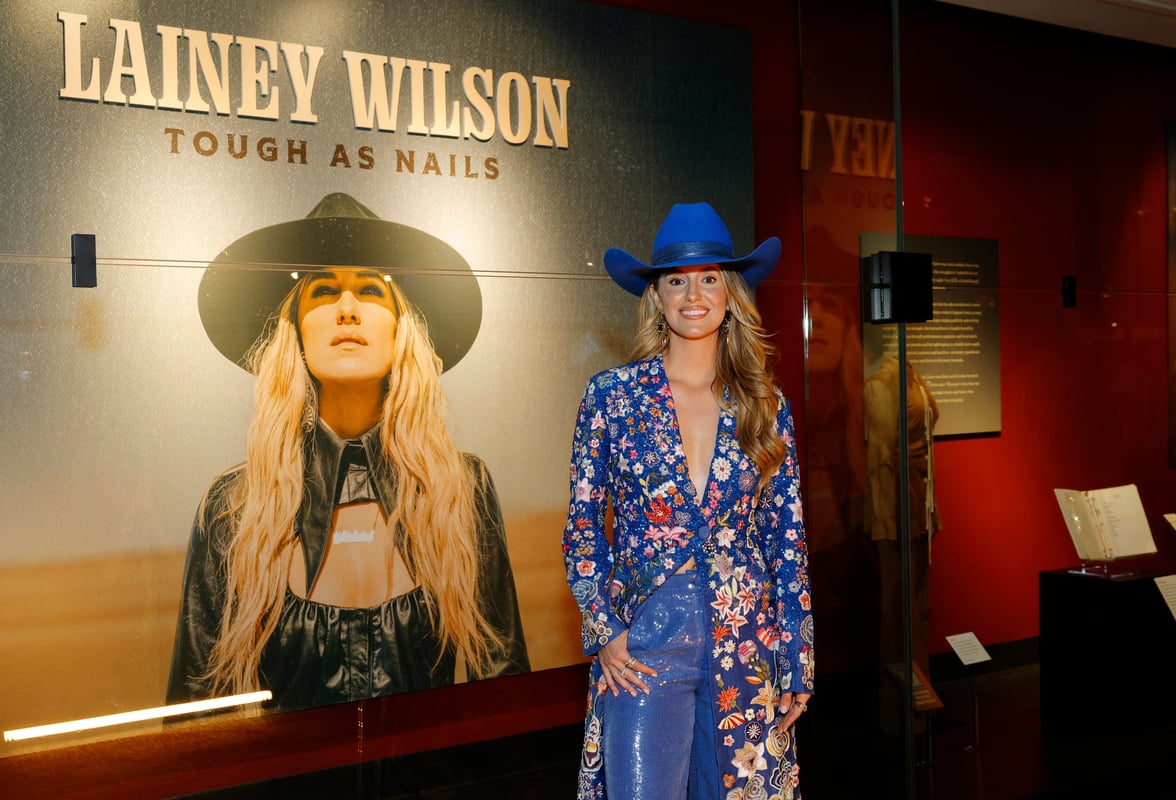 Lainey Wilson at Lainey Wilson: Tough as Nails exhibit inside the Country Music Hall of Fame and Museum; Photo by Jason Kempin/Getty Images for the Country Music Hall of Fame and Museum